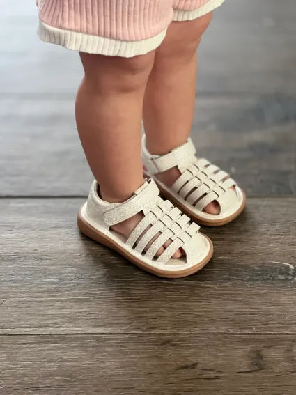 Sunny Pearl | Toddler Squeaky Shoes | mooshu TRAINERS | Everyone needs a strappy sandal. Whether you are planning a trip to the library or dancing your heart away at a wedding, Sunny is the perfect all occasion shoe. The pearl shimmer adds the perfect amount of DAZZLE. 