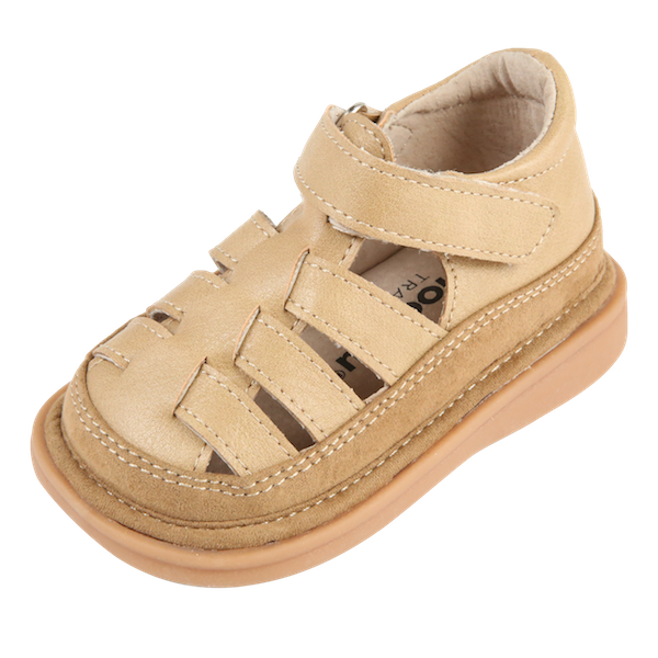 Fisher Sandal | Toddler Squeaky Shoes | mooshu TRAINERS | I see sunny days in our future. Put your Fisher Sandals on and let’s go out and play. The closed toe detail will keep those little piggies protected. The complimentary sandy tones offer a style like no other. Available in Sand and Chocolate